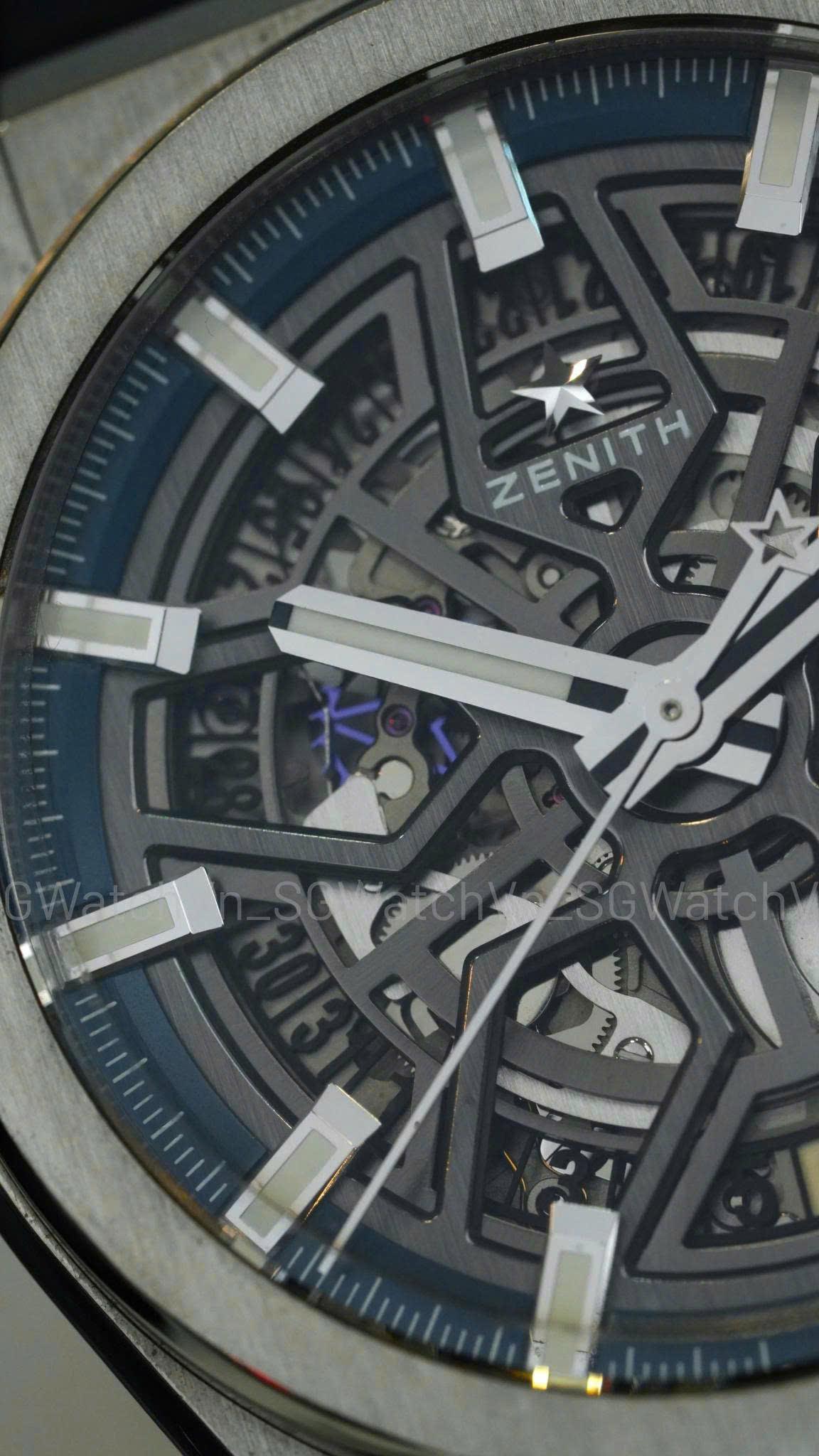 Zenith Defy Classic 95.9000.670/78.R782 – Skeleton Titanium Đậm Chất “Luxury Future”  Trong thế giới đồng hồ Thụy Sĩ cao cấp, Zenith luôn là thương hiệu rất đặc biệt.  Nếu El Primero đại diện cho lịch sử chronograph huyền thoại, thì dòng:  👉 Defy  lại là nơi Zenith thể hiện toàn bộ tư duy:  Hiện đại Công nghệ Và tương lai của đồng hồ cơ học.  Với phiên bản Zenith Defy Classic 95.9000.670/78.R782, Zenith tạo ra một chiếc luxury sports watch mang phong cách hoàn toàn khác biệt:  👉 Skeleton dial hình ngôi sao 👉 Titanium siêu nhẹ 👉 Bộ máy in-house Elite 670 SK 👉 Và thiết kế futuristic cực kỳ nổi bật.  Đây không đơn thuần là một chiếc đồng hồ skeleton.  Mà là một mẫu Zenith:  👉 Rất kỹ thuật 👉 Rất hiện đại 👉 Và cực kỳ “high-end” khi cầm thực tế.  Zenith Defy Classic 95.9000.670/78.R782 172.730.000 ₫ • Luxury Shopping Defy Classic – Bộ Sưu Tập Mang DNA Tương Lai Của Zenith  Dòng Defy được Zenith phát triển như một sân chơi công nghệ và thiết kế mới.  Khác hoàn toàn với phong cách vintage của Chronomaster hay El Primero cổ điển, Defy hướng tới:  👉 Luxury sports watch thế hệ mới.  Điểm nhận diện lớn nhất của Defy nằm ở:  Case góc cạnh mạnh mẽ Dial skeleton hiện đại Và chất liệu titanium / ceramic cao cấp. Skeleton Star Dial – Điểm “Ăn Tiền” Lớn Nhất  Điểm đặc biệt nhất trên ref. 95.9000.670/78.R782 nằm ở:  👉 Mặt số skeleton hình ngôi sao.  Zenith thiết kế dial openworked theo logo ngôi sao 5 cánh biểu tượng của hãng.  Khi nhìn trực tiếp:  Bộ máy lộ cơ cực kỳ đẹp Tạo chiều sâu mạnh Và cho cảm giác rất “high-tech”.  Đây là kiểu đồng hồ:  👉 Nhìn ảnh đã đẹp 👉 Nhưng lên tay thực tế ấn tượng hơn rất nhiều.  Titanium Grade 5 – Siêu Nhẹ Nhưng Cực Kỳ Cao Cấp  Zenith sử dụng:  👉 Titanium Grade 5 cho toàn bộ case.  Ưu điểm của titanium:  Nhẹ hơn thép đáng kể Đeo cực kỳ thoải mái Chống ăn mòn tốt Và cho cảm giác “high-end engineering”.  Khi lên tay Defy Classic:  👉 Cảm giác nhẹ tới mức rất dễ gây bất ngờ.  Đây là một trong những điểm khiến Defy khác biệt hoàn toàn với nhiều luxury sports watch truyền thống.  Size 41mm – Sporty Nhưng Đeo Cực Gọn  Thông số chính thức:  Diameter: 41mm Thickness: khoảng 10.75mm.  Dù mang phong cách futuristic, Defy Classic lại đeo cực kỳ gọn nhờ:  Lug ngắn Case titanium nhẹ Thiết kế ôm tay.  Đây là mẫu đồng hồ:  👉 Rất dễ đeo daily dù nhìn khá “kỹ thuật”.  Bộ Máy Elite 670 SK – In-House Và Hoàn Thiện Rất Đẹp  Điểm đáng giá nhất trên mẫu Defy này nằm ở:  👉 Zenith Elite 670 SK In-House.  Thông số nổi bật:  Automatic manufacture movement Skeletonized caliber Silicon escapement 27 chân kính Tần số 28,800 vph / 4Hz Trữ cót khoảng 50 giờ. Vì Sao Elite 670 SK Được Đánh Giá Cao?  Elite là dòng movement ultra-thin nổi tiếng của Zenith.  Phiên bản 670 SK được skeleton hóa để phù hợp với Defy Classic.  Ưu điểm:  Máy mỏng Hoạt động ổn định Hoàn thiện đẹp Và rất hiện đại nhờ silicon escapement.  Đây là kiểu movement:  👉 Vừa có kỹ thuật 👉 Vừa có tính trình diễn rất mạnh.  Silicon Escapement – Công Nghệ Cao Cấp Của Zenith  Zenith trang bị:  👉 Silicon pallet lever và escape wheel.  Điều này giúp:  Giảm ma sát Tăng độ ổn định Kháng từ tốt hơn Và cải thiện hiệu suất vận hành.  Đây là công nghệ thường xuất hiện trên các dòng high-end hiện đại.  Kính Sapphire Và Hiệu Ứng “Không Gian Cơ Khí”  Mẫu Defy Classic này được trang bị:  Sapphire chống trầy Sapphire caseback trong suốt.  Khi nhìn trực tiếp:  👉 Toàn bộ đồng hồ giống như một “cỗ máy cơ khí lơ lửng”.  Đây chính là điểm khiến Defy Classic có chất futuristic rất riêng.  Dây Rubber – Chất Sport Luxury Rất Rõ  Phiên bản R782 đi kèm:  👉 Dây rubber tích hợp cao cấp.  Điều này giúp đồng hồ:  Đeo nhẹ Thoải mái Và sporty hơn đáng kể.  Đặc biệt với case titanium, cảm giác lên tay cực kỳ “techwear luxury”.  Trải Nghiệm Đeo – Một Chiếc Zenith Rất Khác Biệt  Defy Classic không dành cho người thích phong cách vintage.  Nó dành cho người thích:  👉 Công nghệ 👉 Thiết kế hiện đại 👉 Và luxury sports watch thế hệ mới.  Đây là kiểu đồng hồ:  Đi casual cực đẹp Đi chơi rất nổi bật Và cực kỳ hút mắt với người hiểu đồng hồ. Giá Trị Sưu Tầm Và Thanh Khoản  Defy Classic được đánh giá rất cao trong cộng đồng Zenith vì:  Thiết kế độc đáo Bộ máy in-house Titanium cao cấp Và số lượng ngoài thị trường không quá nhiều.  Theo dữ liệu WatchCharts, dòng Defy Classic 95.9000.670/78 có hiệu suất thị trường khá tốt trong vài năm gần đây.  Kết Luận  Zenith Defy Classic 95.9000.670/78.R782 là mẫu đồng hồ dành cho người thích:  👉 Luxury sports watch hiện đại 👉 Skeleton dial cực kỳ kỹ thuật 👉 Và chất titanium siêu nhẹ cao cấp.  Một chiếc Zenith:  Đeo rất khác biệt Rất futuristic Và càng nhìn lâu càng thấy đẳng cấp.