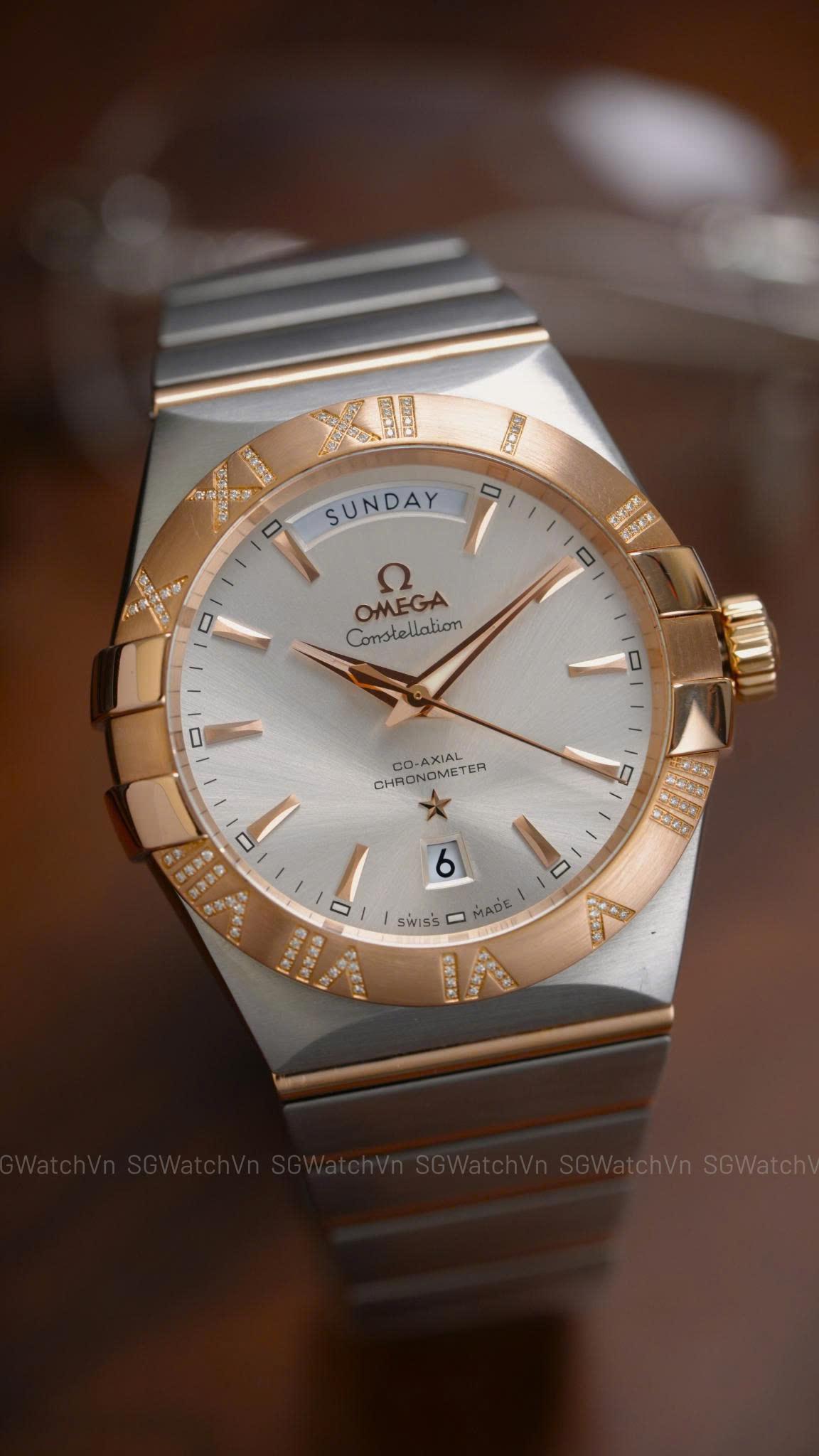 Omega Constellation Co-Axial Day-Date 123.25.38.22.02.001 – 38mm Demi Vàng Hồng 18K, Bezel Kim Cương